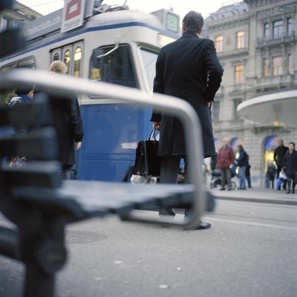 man waiting for tram
