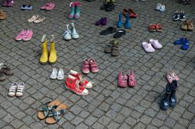 Children shoes on a square