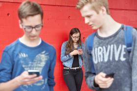 Young people on mobile phones