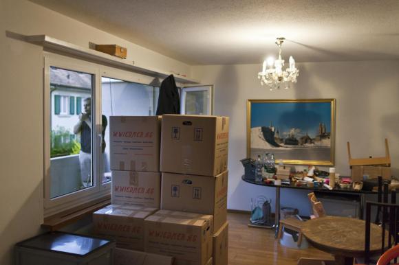 Room full of boxes and furniture
