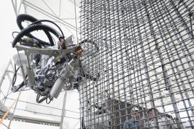 Robot works on metal frame