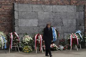 Switzerland s President Simonetta Sommaruga walks away after laying a wreath at the Death Wall at the Auschwitz