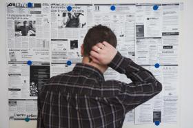 man looking at job ads