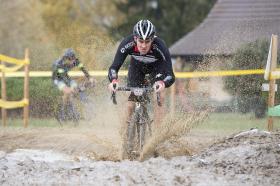 man riding bike in mud