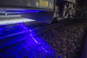 laser beam on train track