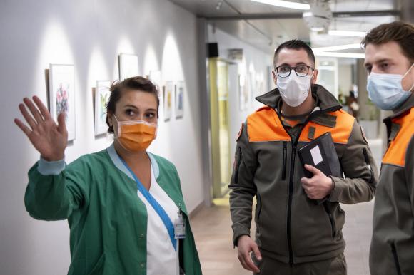 Three hospital workers wearing masks