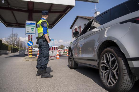 Border guard making a control on a car entering switzerland