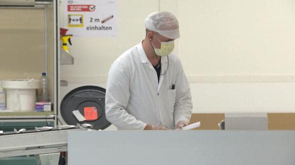 Man making masks on factory production line