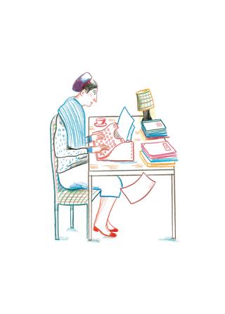 Una mujer sentada frente a una máquina de escribir