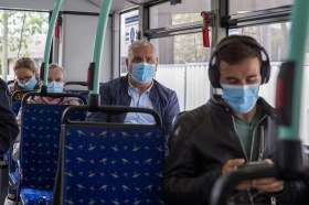 Passengers in public transport wearing protective masks