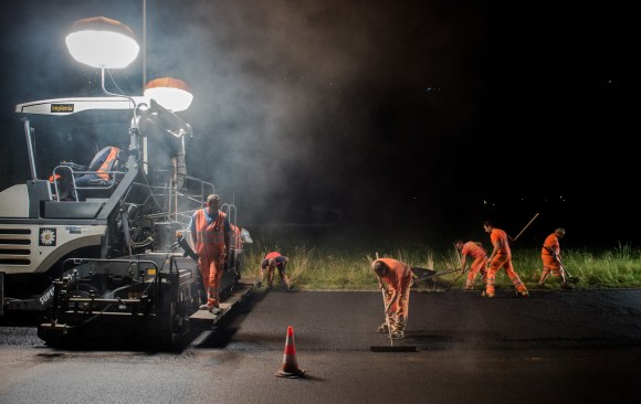 Construction workers at night