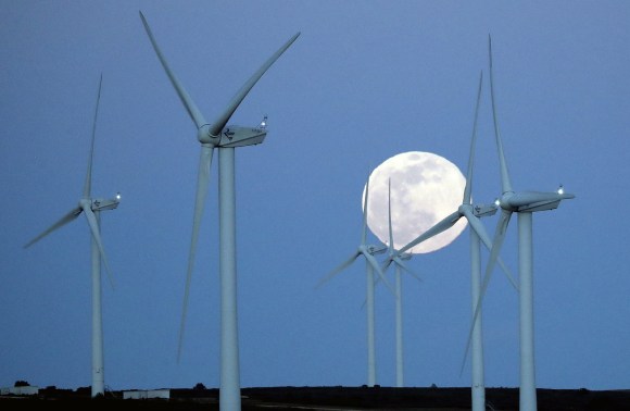 Moon rises over wind farm