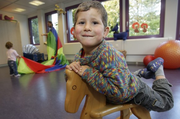 Boy on a rocking horse in a daycare centre