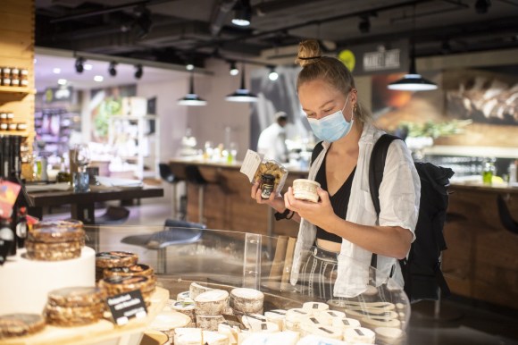 Lady buying food in a mask