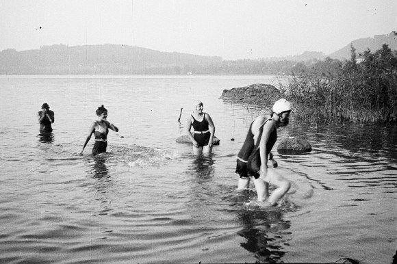 Women swimming in a lake.