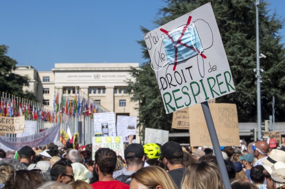 Anti-mask demonstrators outside the UN headquarters in Geneva