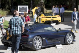People look at expensive sports cars