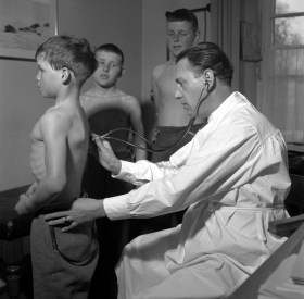 doctor examining child