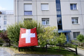 house with Swiss flag