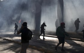 Protesters wreathed in smoke in Chile