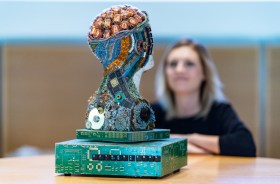 A sculpture of a head made of electronic components.