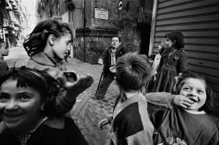 Naples. Children and a beggar. 1962.
