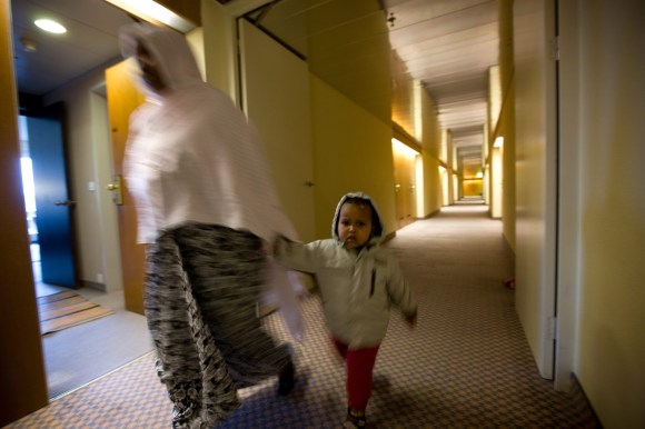 Eritrean woman with toddler in a corridor