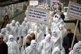 protesters in white suits