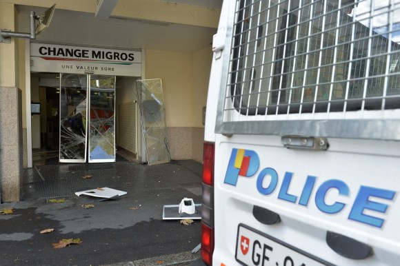 Police van and broken glass door