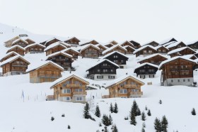 Chalets with snow in a Swiss mountain resort