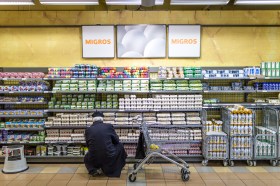 Man shopping for eggs in a supermarket