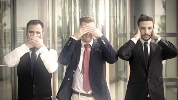 Bankers covering eyes or ears