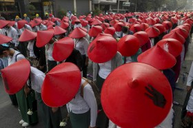 Teachers in Myanmar waering red hats