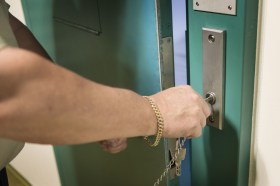 Prison guard locking door