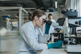 Women looking through microscope