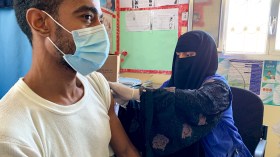 man being vaccinated in Yemen