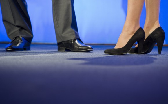 Shoes of a businessman and a businesswoman