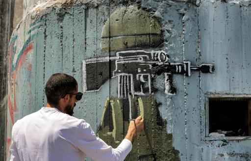 فنان فلسطيني يندد بالاحتلال من خلال رسوم غرافيتي على &quot;الجدار&quot; الإسرائيلي -  SWI swissinfo.ch