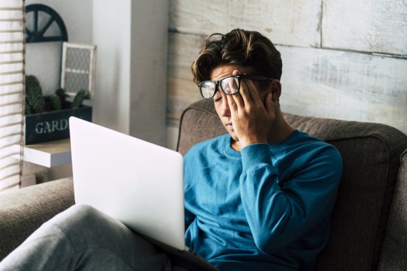 Student stressed in front of computer