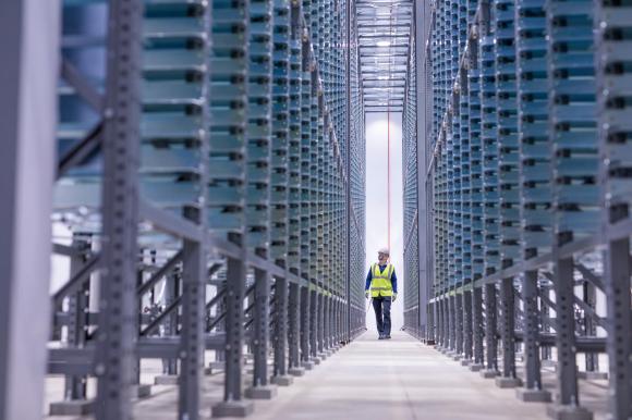 Man walking down gigafactory passage