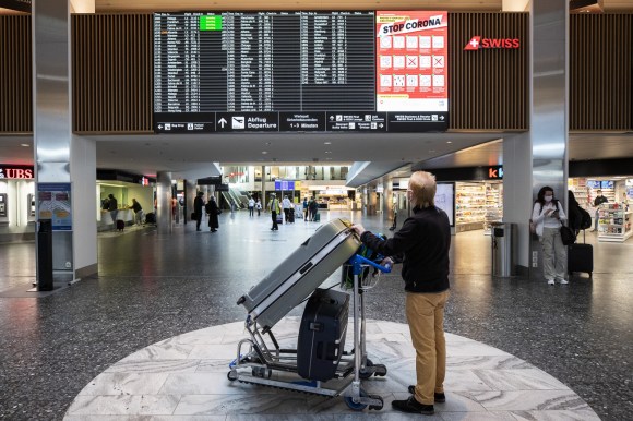 Man with luggage waiting at airport