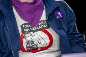 A woman wearing a T-shirt with the slogan, Touche pas à ma retraite [Don t touch my pension].