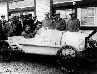Arthur and Gaston Chevrolet (with Moustaches) stand behind as Louis Chevrolet