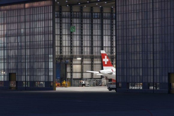 Tail of SWISS plane sticks out of aircraft hanger