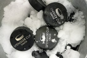 Ice hockey pucks in snow
