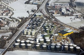 Aerial view of oil tanks in wintry landscape