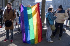 demonstration with rainbow flag