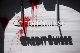 Credit Suisse logo daubed with red paint