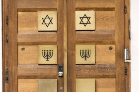 Door to synagogue with Star of David and Menora in Zurich
