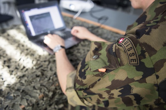 Swiss army member with computer
